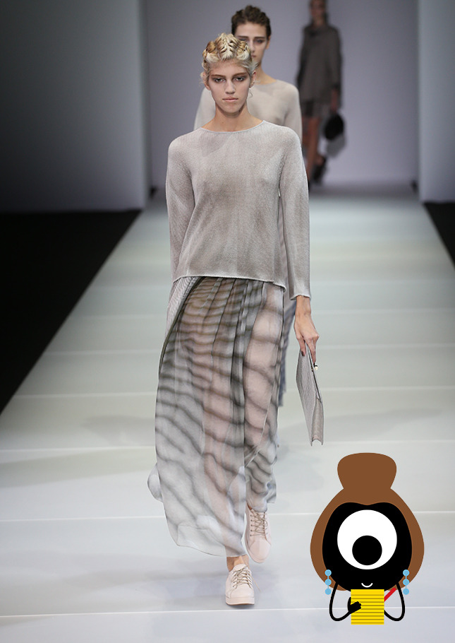 Giorgio Armani Plays in the Sand